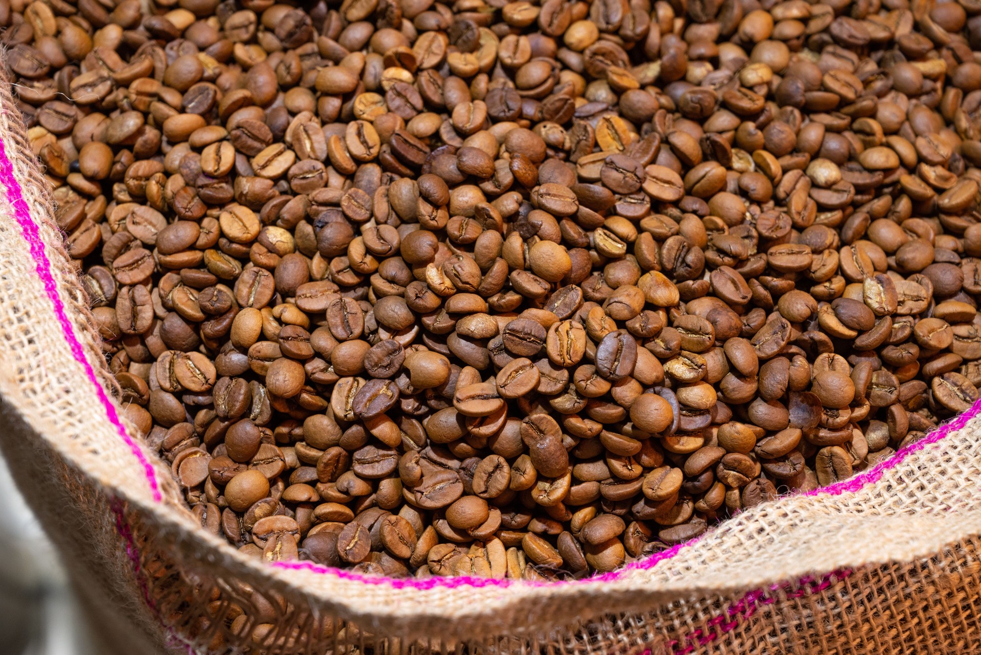 Close-up shot of roasted Turkish coffee beans in a sack