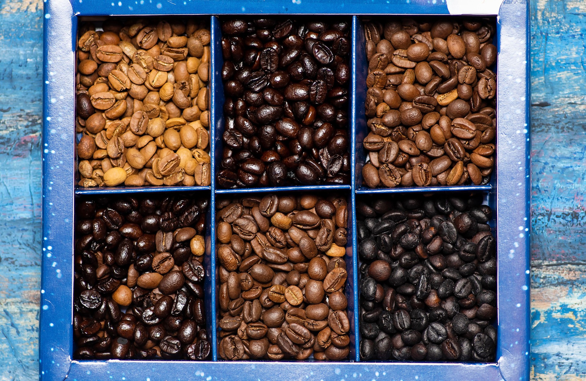 Various coffee beans background pattern flat lay